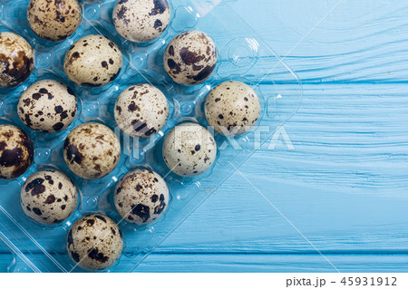Raw qail eggs background 45931912
