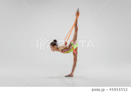 The teenager girl doing gymnastics exercises isolated on white background 45933552