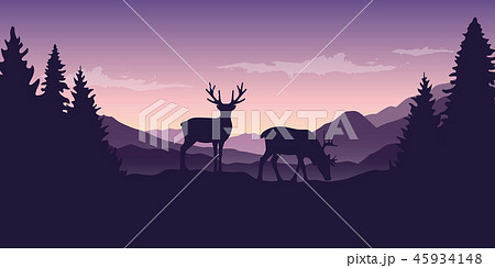 two wildlife reindeers on purple mountain and forest landscape 45934148