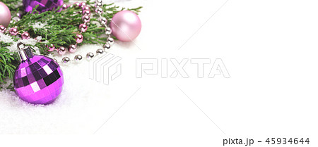 Christmas baubles and evergreen branches on white. 45934644