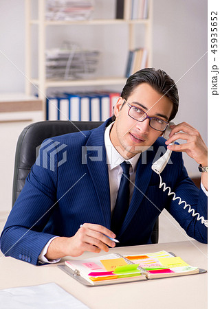 Young handsome employee planning his work activity  45935652