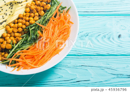 Buddha bowl with avocado cucumber carrot chickpea 45936796