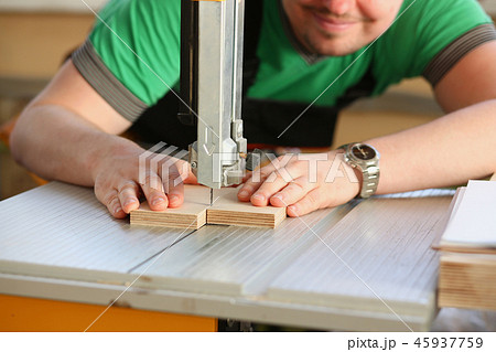 Worker using electric saw portrait 45937759