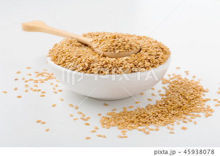 Golden flaxseed in wooden spoon and bowl Golden flaxseed in wooden spoon and bowl 45938078
