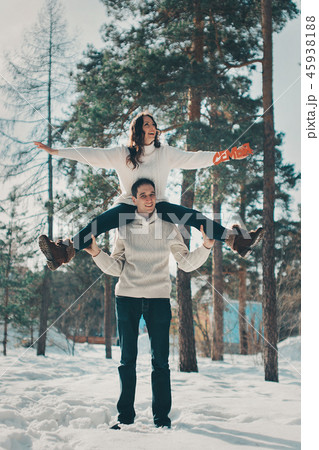man and woman playing in the snow. man and woman playing in the snow. 45938188