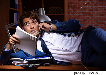 Young businessman working in the office at night  Young businessman working in the office at night  45938555