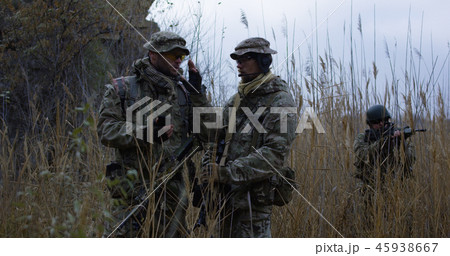 Reviewing a map on a handheld device Reviewing a map on a handheld device 45938667
