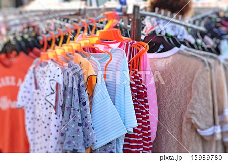 shop clothes for sales at market. 45939780