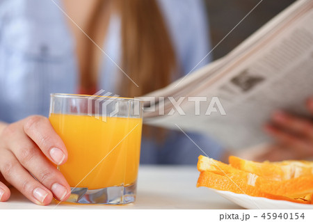 Beautiful woman hold in arms glass of orange juice 45940154