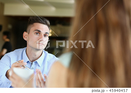 young beautiful man and woman meet in cafe business 45940457