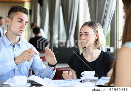 Business meeting in a cafe young beautiful men 45940458