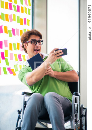 Young student in wheelchair with many conflicting priorities  45940671