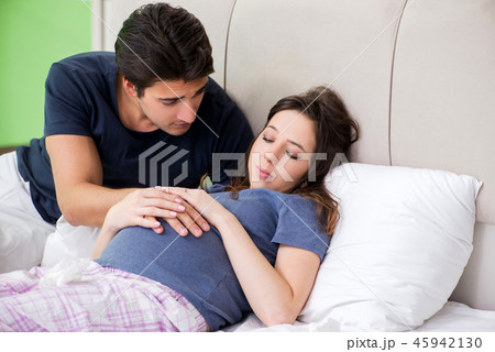 Young husband looking after his pregnant wife 45942130