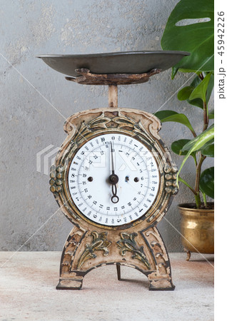 Old vintage kitchen scale on concrete background. 45942226