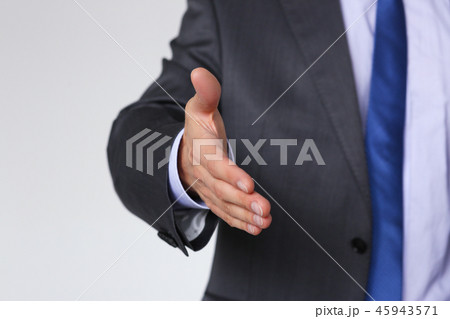 Man in suit and tie give hand as hello Man in suit and tie give hand as hello 45943571