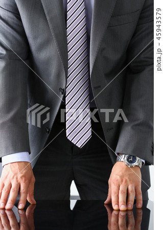 Empty arms of man in suit and tie closeup 45943579