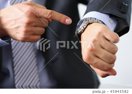 Man in suit and tie check out time 45943582