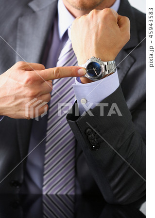Man in suit and tie check out time Man in suit and tie check out time 45943583