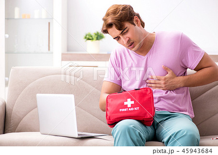 Sick man at home with first aid kit Sick man at home with first aid kit 45943684