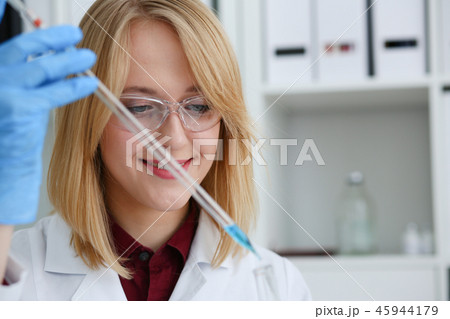 Technician hold in arms in protective gloves Technician hold in arms in protective gloves 45944179