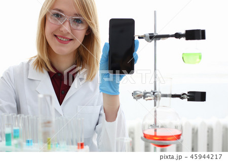 A female doctor in a chemical laboratory holds 45944217