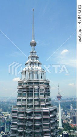 KUALA LUMPUR, MALAYSIA - APR 12th 2015: Detail of top of Petronas towers in Kuala Lumpur viewed KUALA LUMPUR, MALAYSIA - APR 12th 2015: Detail of top of Petronas towers in Kuala Lumpur viewed 45944281