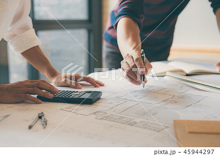 Team of Construction engineering or architect hands working on b Team of Construction engineering or architect hands working on b 45944297