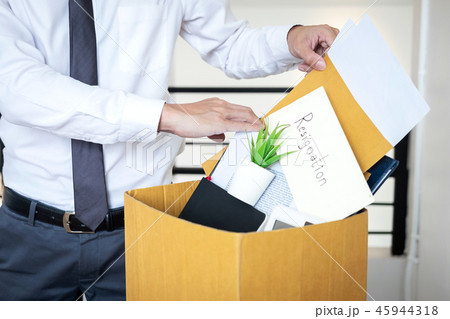 Businessman sending letter will being resignation and carrying p Businessman sending letter will being resignation and carrying p 45944318