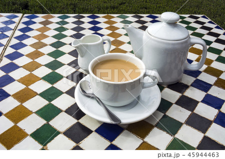 Pot of tea on ceramic tiled table in Moroccan cafe 45944463