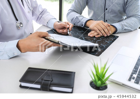 Professor Doctor having conversation with patient and holding x- Professor Doctor having conversation with patient and holding x- 45944532