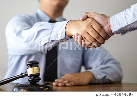 Handshake after consultation between a male lawyer and client, g Handshake after consultation between a male lawyer and client, g 45944597