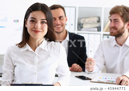 Beautiful smiling cheerful girl at workplace look Beautiful smiling cheerful girl at workplace look 45944771