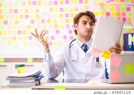 Male doctor with many conflicting prioritites Male doctor with many conflicting prioritites 45945119