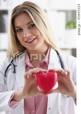 Beautiful smiling blond female doctor hold 45945324