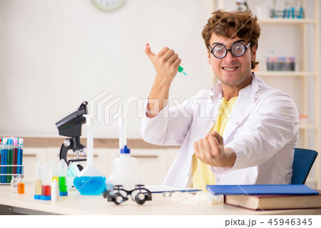 Funny crazy chemist doing experiments and tests Funny crazy chemist doing experiments and tests 45946345