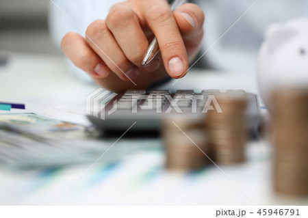 Male hand push key silver calculator is lying Male hand push key silver calculator is lying 45946791