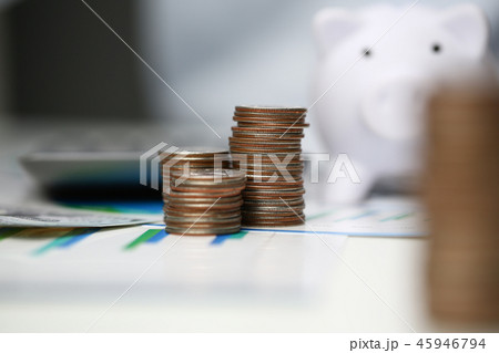 Towers of coins on background office. 45946794