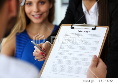 Female arm offer contract form on clipboard pad Female arm offer contract form on clipboard pad 45946921