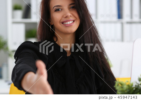 Woman hold document pad give arm as hello in office Woman hold document pad give arm as hello in office 45947143