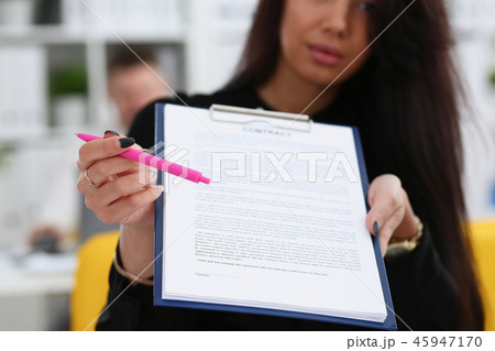 Female arm offer contract form on clipboard pad 45947170