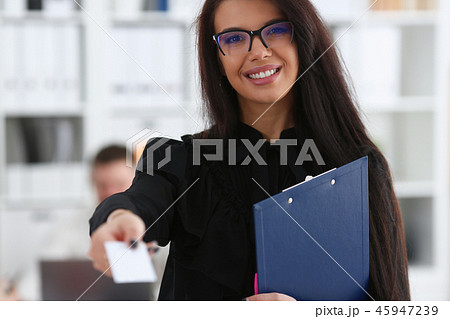 Female arm give blank calling card to visitor Female arm give blank calling card to visitor 45947239