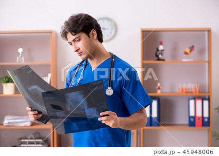Young handsome doctor working in the hospital Young handsome doctor working in the hospital 45948006