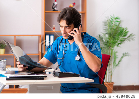 Young handsome doctor radiologyst working in clinic Young handsome doctor radiologyst working in clinic 45948029