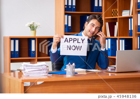 Young employee working in the office Young employee working in the office 45948136