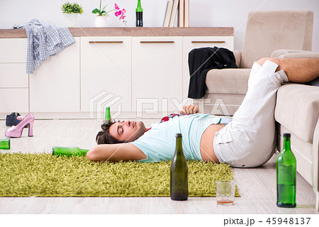 Young drunk handsome man after party at home  45948137