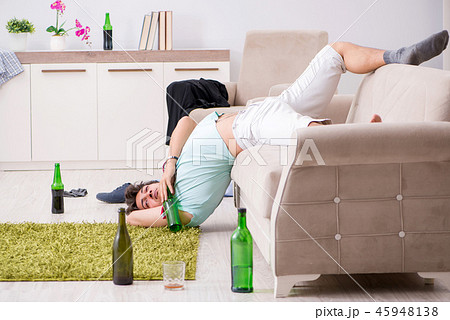 Young drunk handsome man after party at home Young drunk handsome man after party at home 45948138