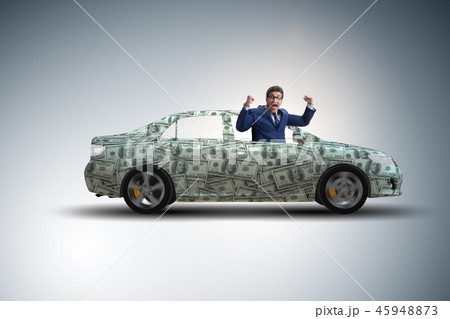Businessman driving car covered with us dollars 45948873