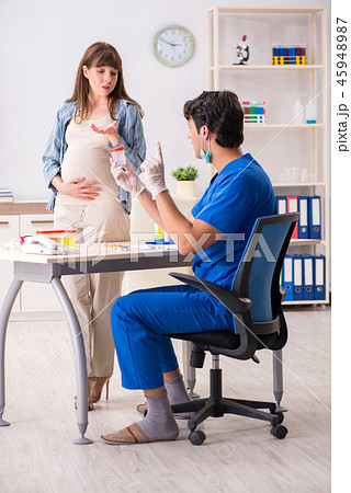Pregnant woman visiting doctor for check-up 45948987