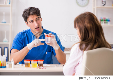 Patient visiting doctor for urine test 45948993
