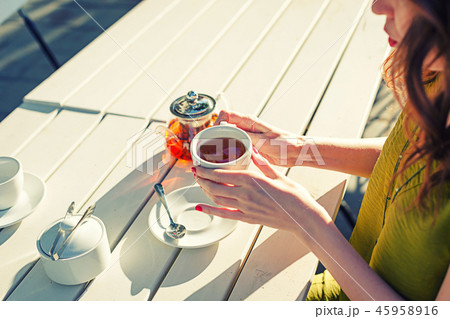 Toned image of a girl drinking a tea 45958916